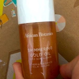 African botanical shimmer gold oil.